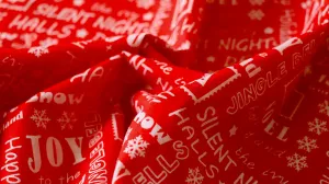 REMNANT 0.60m x 1.12m - CHRISTMAS POLYCOTTON - Christmas song lyric design
