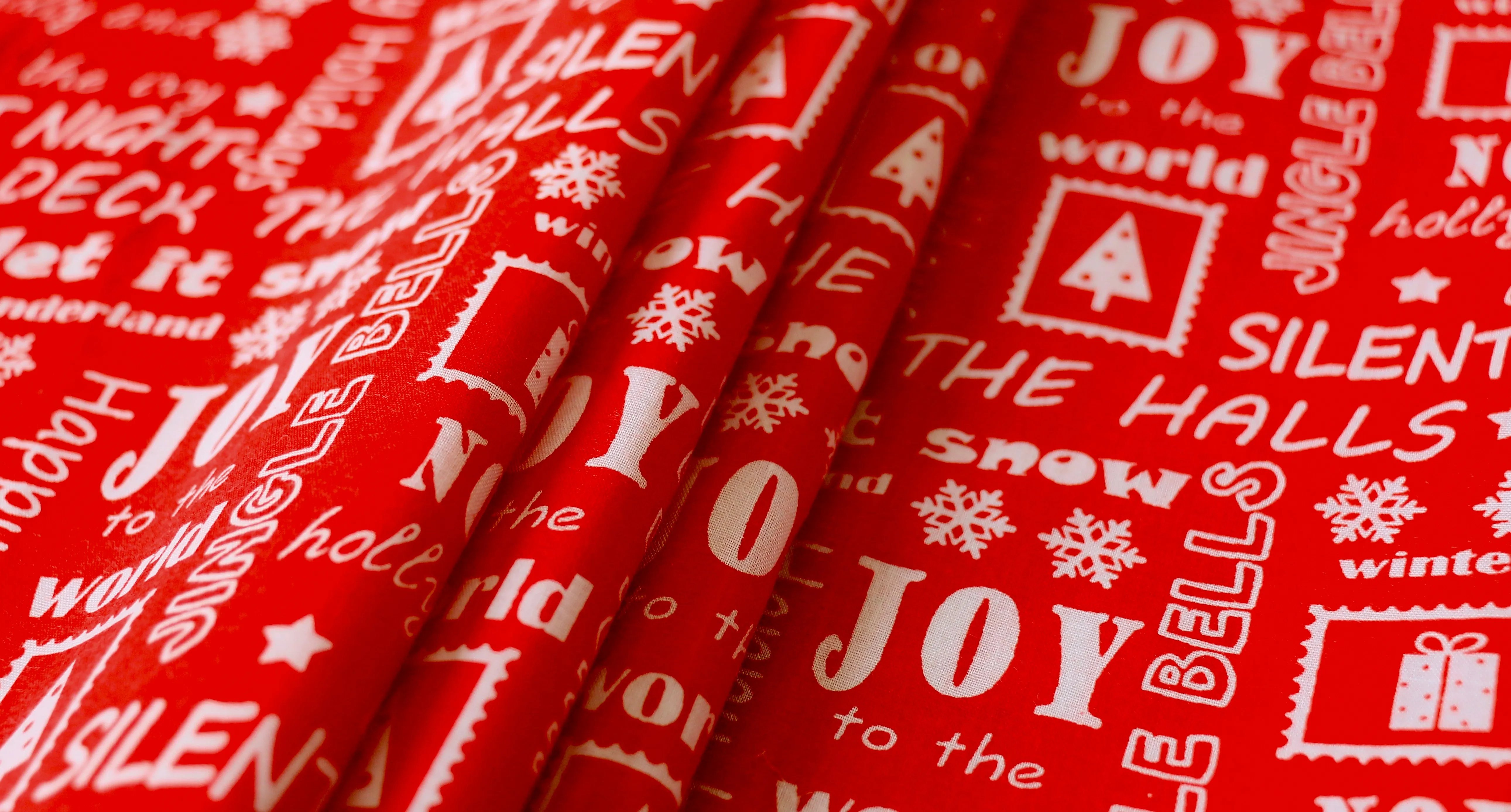 REMNANT 0.60m x 1.12m - CHRISTMAS POLYCOTTON - Christmas song lyric design
